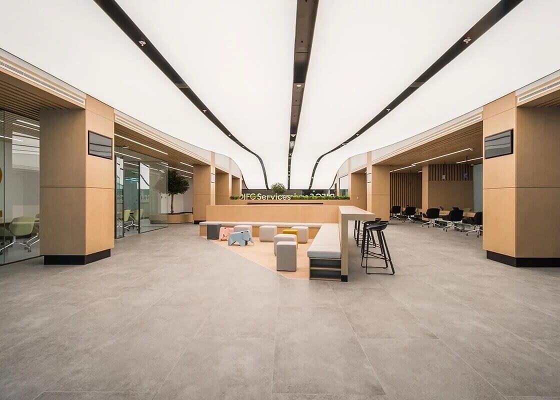 Modern waiting room with recessed lightbox lighting.