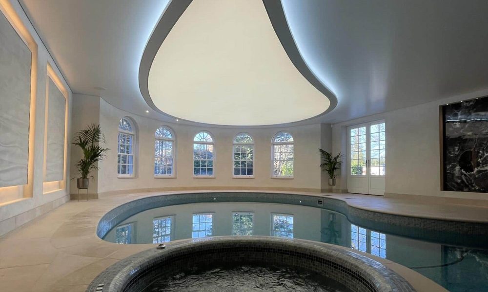 Indoor swimming pool with a Kenston teardrop ceiling light.