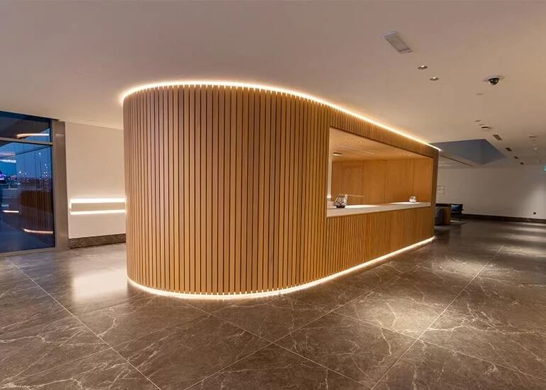 Wooden reception desk with LED strip lights
