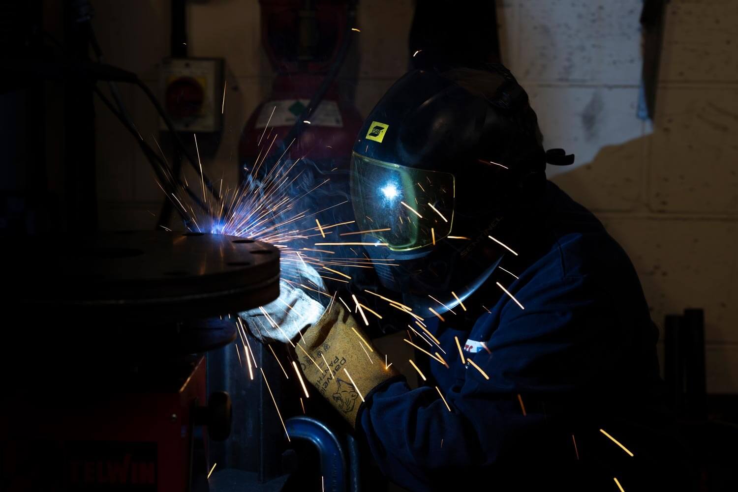 Main with mask on welding