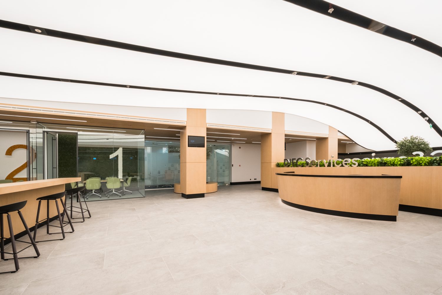 Stretch ceiling installation in a modern office space